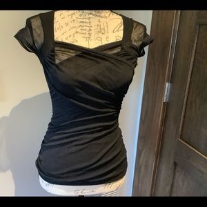 Black Criss Cross short sleeved top.